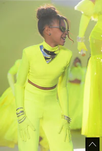 a young girl in a neon yellow outfit