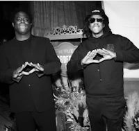 two men in black and white standing next to each other